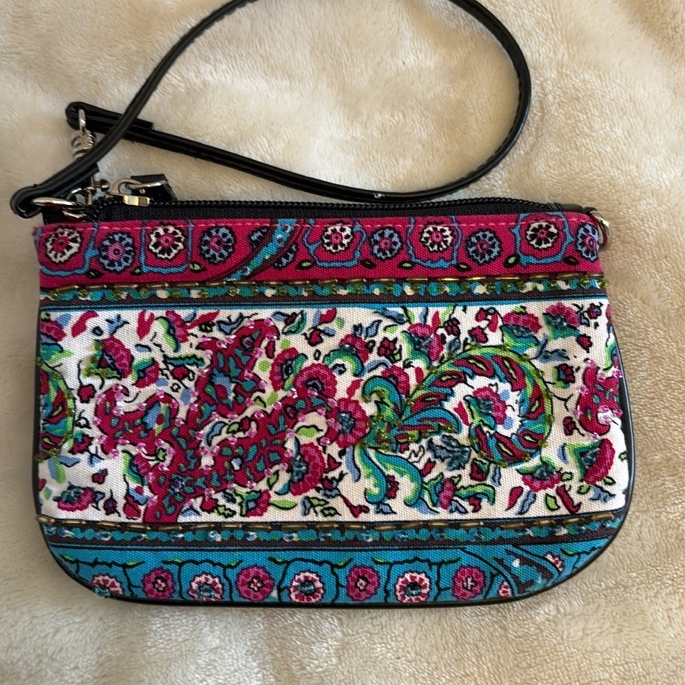 PINK AND BLUE FLORAL DESIGN WRISTLET WITH SOME BEADS ON ONE SIDE AND BLACK STRAP